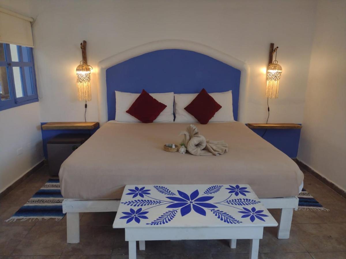 Mio Tulum Hotel Boutique Exterior foto A bedroom in a hotel in Santorini, Greece